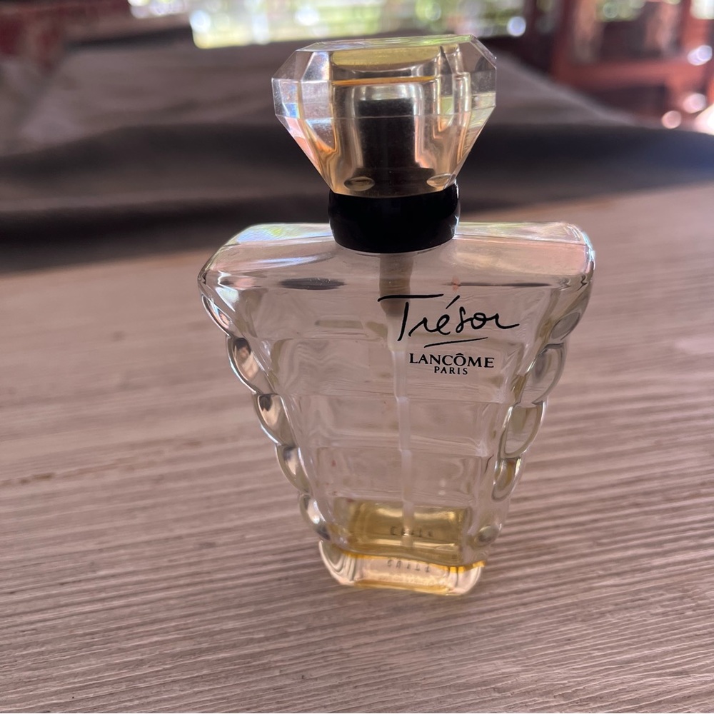 Empty Lancôme Tresor Eau de Parfume bottle. Very tiny amount of residual.